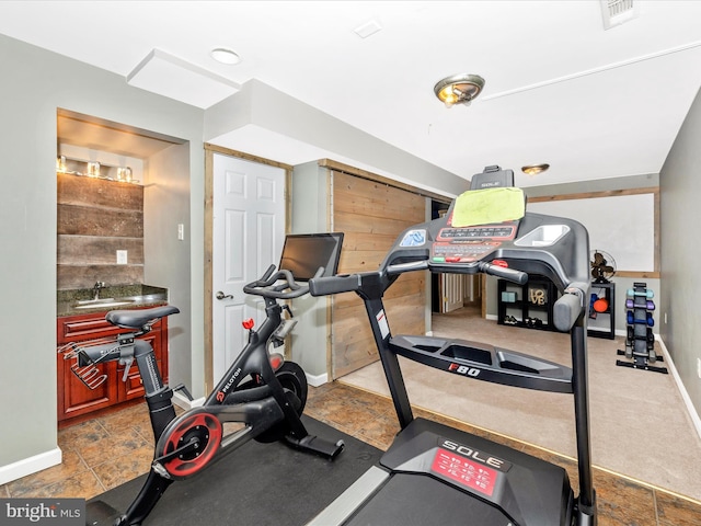 exercise room with baseboards