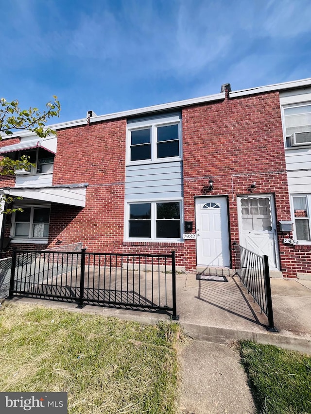 7932 Wynbrook Rd, Baltimore, MD 21224 - townhome / multi-family property with brick siding, fence, and cooling unit