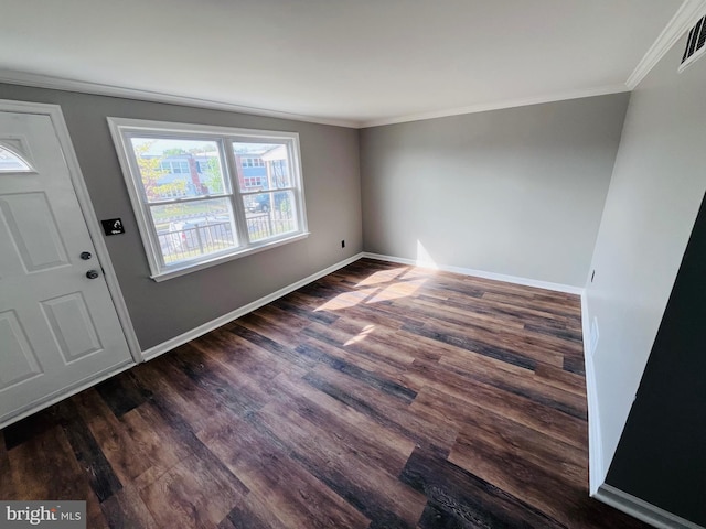 7932 Wynbrook Rd, Baltimore, MD 21224 - entryway with baseboards, ornamental molding, dark wood finished floors, and visible vents