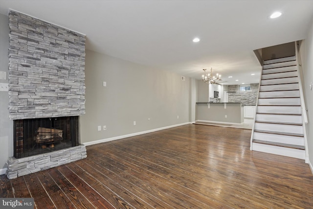 1110 Lombard St Unit 22, Philadelphia, PA 19147 - unfurnished living room featuring hardwood / wood-style floors, a fireplace, stairway, recessed lighting, and a chandelier
