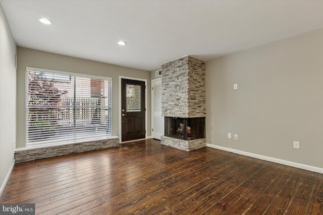 1110 Lombard St Unit 22, Philadelphia, PA 19147 - unfurnished living room featuring visible vents, a fireplace, baseboards, recessed lighting, and hardwood / wood-style floors