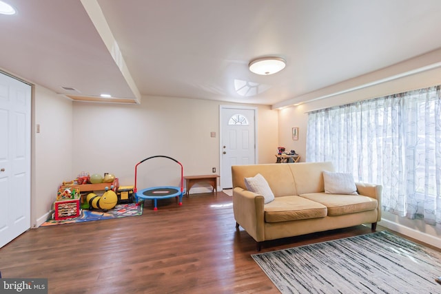 living room with wood finished floors and baseboards
