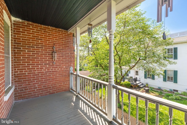 wooden terrace with covered porch