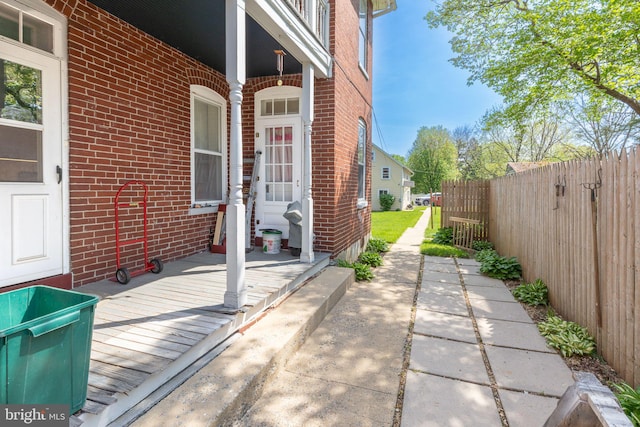 view of patio with fence and a wooden deck