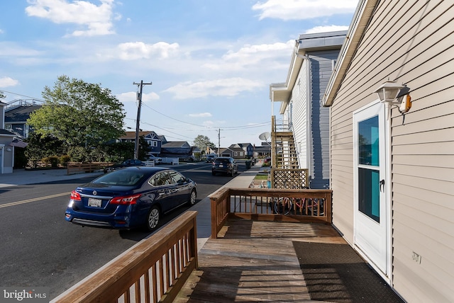 wooden deck featuring a residential view