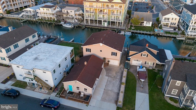 aerial view with a water view and a residential view