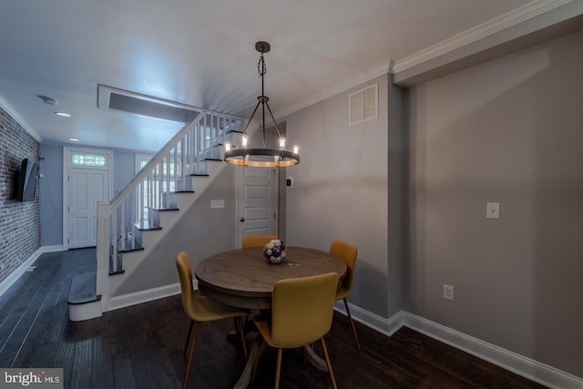 dining area featuring an inviting chandelier, dark wood finished floors, stairs, baseboards, and visible vents