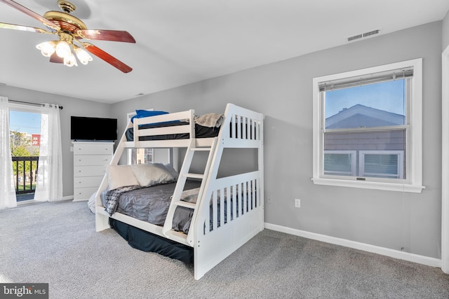 bedroom featuring ceiling fan, access to exterior, visible vents, baseboards, and carpet
