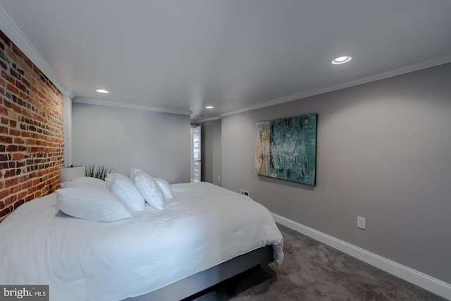 carpeted bedroom featuring crown molding, baseboards, recessed lighting, and brick wall