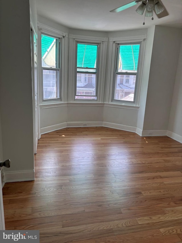 3086 Cedar St, Philadelphia, PA 19134 - spare room featuring wood finished floors, baseboards, and ceiling fan