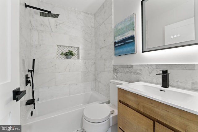 5123 8th St NW, Washington, DC 20011 - bathroom featuring bathing tub / shower combination, toilet, tile walls, wainscoting, and vanity