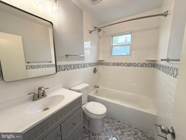 bathroom with visible vents, tile walls, vanity, toilet, and tub / shower combination