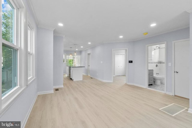unfurnished living room featuring light wood-style floors, recessed lighting, baseboards, visible vents, and ornamental molding