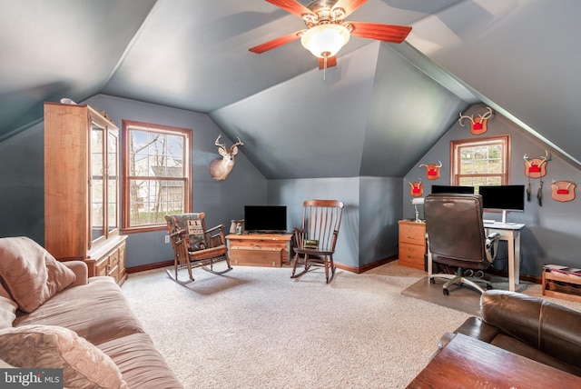 office area featuring carpet, lofted ceiling, and baseboards