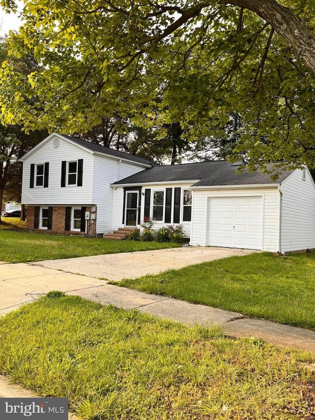 115 Pates Dr, Fort Washington, MD 20744 - tri-level home with a garage, driveway, and a front yard