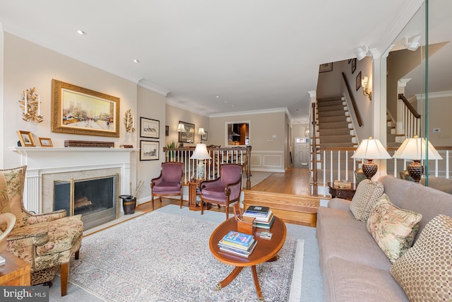 4360 Westover Pl NW, Washington, DC 20016 - living room with stairs, a wainscoted wall, wood finished floors, crown molding, and a premium fireplace