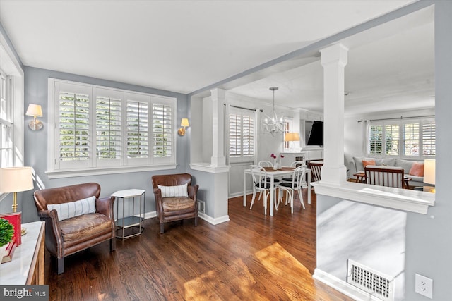 3306 Old Dominion Blvd, Alexandria, VA 22305 - living area featuring ornate columns, wood finished floors, and a chandelier