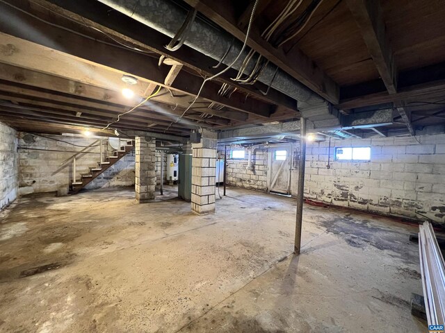 below grade area with water heater and stairs