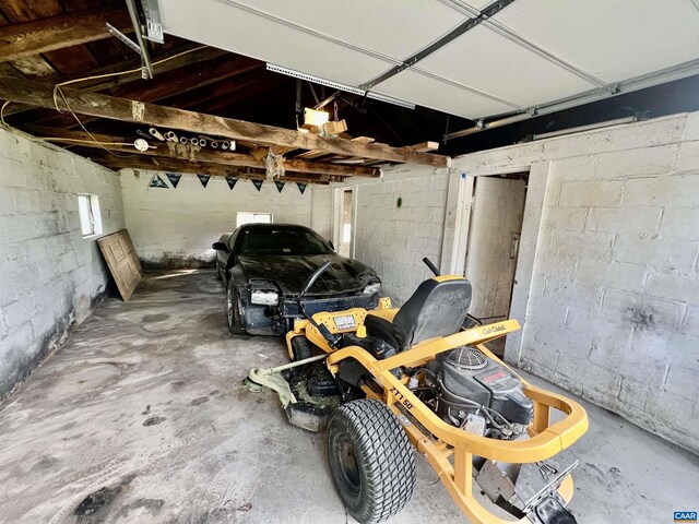 garage with concrete block wall