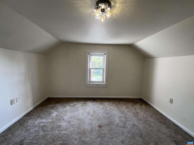 bonus room featuring baseboards, carpet flooring, and lofted ceiling