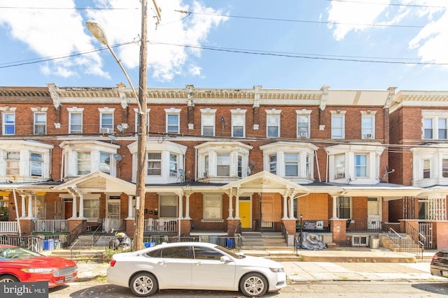 3547 N 21st St, Philadelphia, PA 19140 - townhome / multi-family property featuring brick siding and a porch