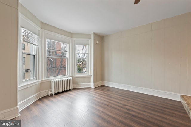 3547 N 21st St, Philadelphia, PA 19140 - empty room featuring baseboards, radiator, ceiling fan, and dark wood-style flooring