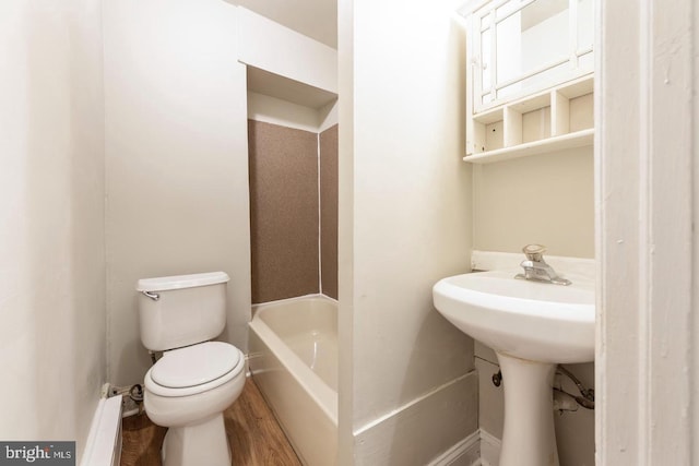 3547 N 21st St, Philadelphia, PA 19140 - bathroom with toilet, a baseboard heating unit, and wood finished floors