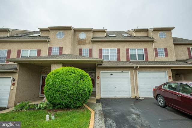 218 Parkview Dr, Souderton, PA 18964 - view of property featuring driveway, stucco siding, and an attached garage