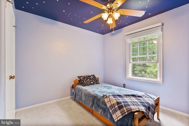 carpeted bedroom with baseboards