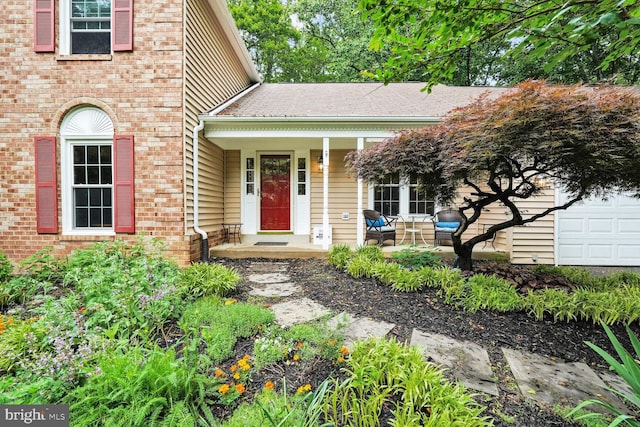 view of front of house with a porch and brick siding