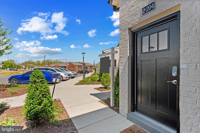 doorway to property with a residential view