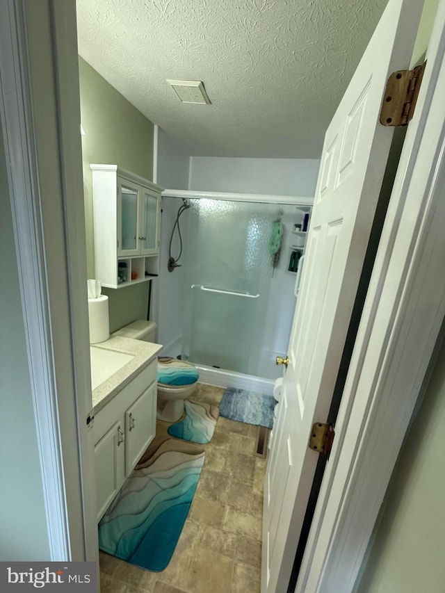 1175 Brook Ct, Front Royal, VA 22630 - full bath with a shower stall, vanity, toilet, and a textured ceiling