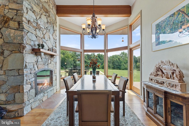 18291 Calumet Ln, Bluemont, VA 20135 - dining area featuring a fireplace, beam ceiling, a healthy amount of sunlight, and a chandelier
