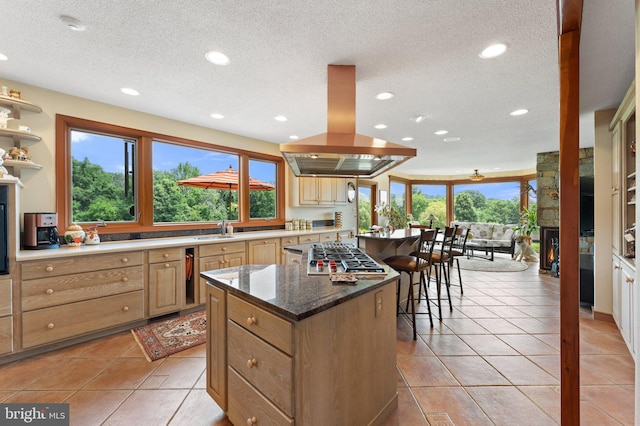 18291 Calumet Ln, Bluemont, VA 20135 - kitchen featuring island exhaust hood, stainless steel gas stovetop, a kitchen island, and recessed lighting