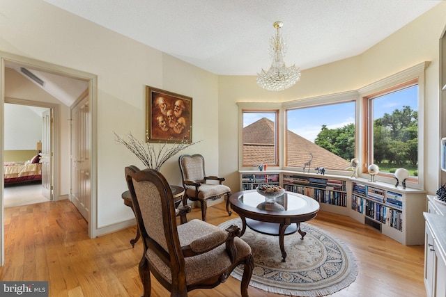 18291 Calumet Ln, Bluemont, VA 20135 - living area featuring a notable chandelier and light wood-type flooring
