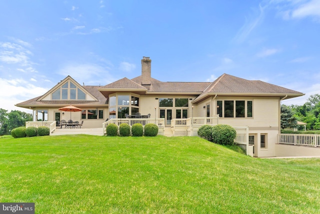 18291 Calumet Ln, Bluemont, VA 20135 - rear view of house featuring a lawn, a patio area, and a chimney