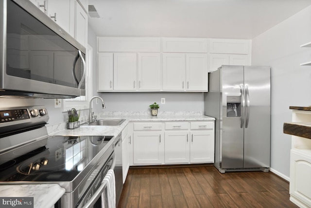 6033 Sweet Dale Ct, Springfield, VA 22152 - kitchen featuring appliances with stainless steel finishes, a sink, dark wood-style floors, and white cabinets