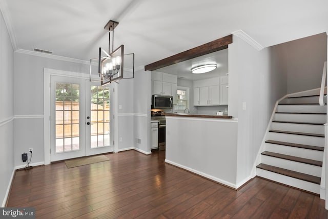 6033 Sweet Dale Ct, Springfield, VA 22152 - kitchen with appliances with stainless steel finishes, a chandelier, baseboards, white cabinetry, and healthy amount of natural light