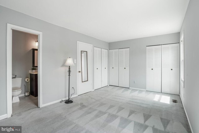 6033 Sweet Dale Ct, Springfield, VA 22152 - unfurnished bedroom featuring multiple closets and baseboards