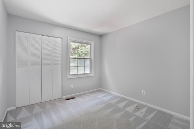 6033 Sweet Dale Ct, Springfield, VA 22152 - unfurnished bedroom featuring baseboards, carpet flooring, and a closet