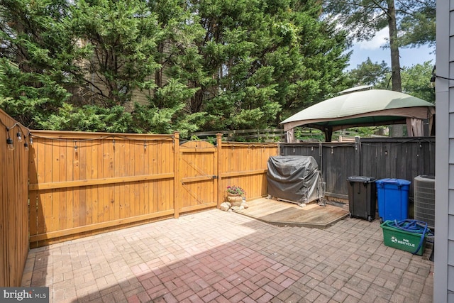 6033 Sweet Dale Ct, Springfield, VA 22152 - view of patio with grilling area, a gate, a gazebo, and central air condition unit