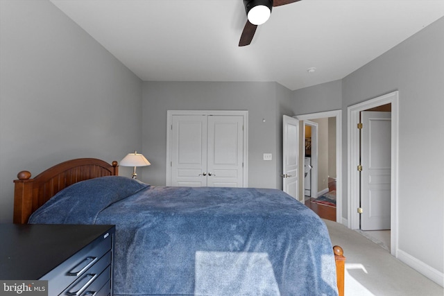 carpeted bedroom with baseboards, ceiling fan, and a closet