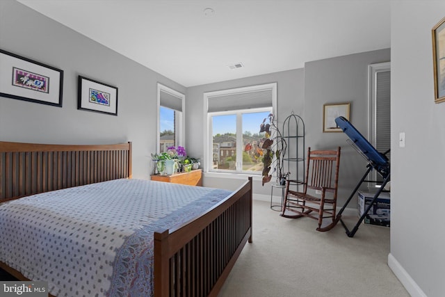bedroom with visible vents, carpet flooring, and baseboards