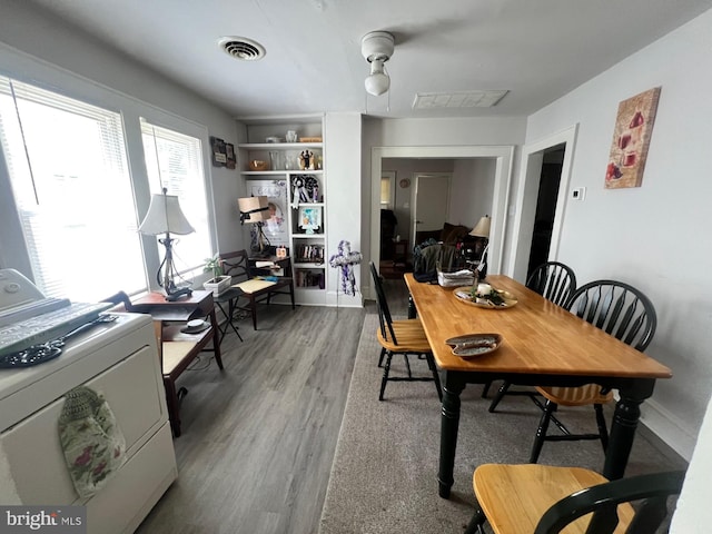 611 Truitt St, Salisbury, MD 21804 - dining space featuring washer / dryer, visible vents, wood finished floors, and baseboards