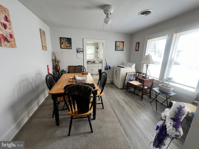 611 Truitt St, Salisbury, MD 21804 - dining space with visible vents, separate washer and dryer, a ceiling fan, baseboards, and light wood-style floors