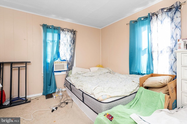bedroom featuring ornamental molding, cooling unit, and carpet flooring