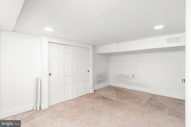 finished basement with carpet flooring, recessed lighting, visible vents, and baseboards