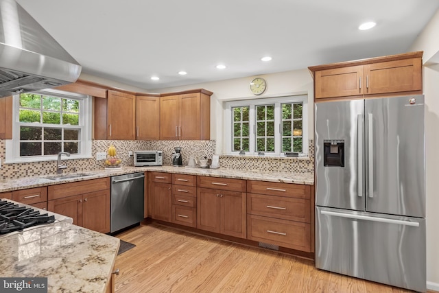 4 Rooftree Rd, Cherry Hill, NJ 08003 - kitchen with appliances with stainless steel finishes, wall chimney range hood, a sink, light wood-type flooring, and light stone counters