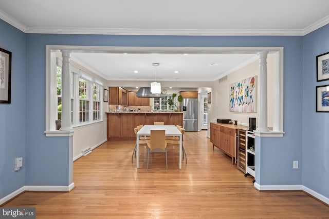 4 Rooftree Rd, Cherry Hill, NJ 08003 - dining area with ornate columns, light wood-style flooring, baseboards, beverage cooler, and ornamental molding
