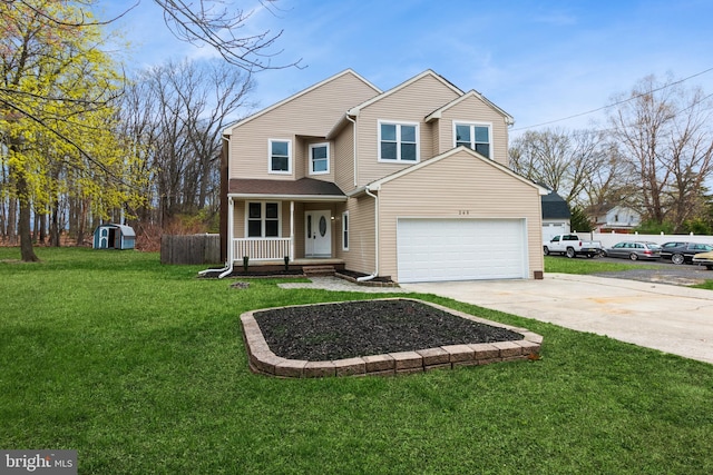 265 S Charleston Ave, Lawnside, NJ 08045 - traditional home with covered porch, concrete driveway, a front lawn, and a garage
